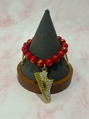 Gold and Red Beaded Bracelet with Crystal Piano Charm